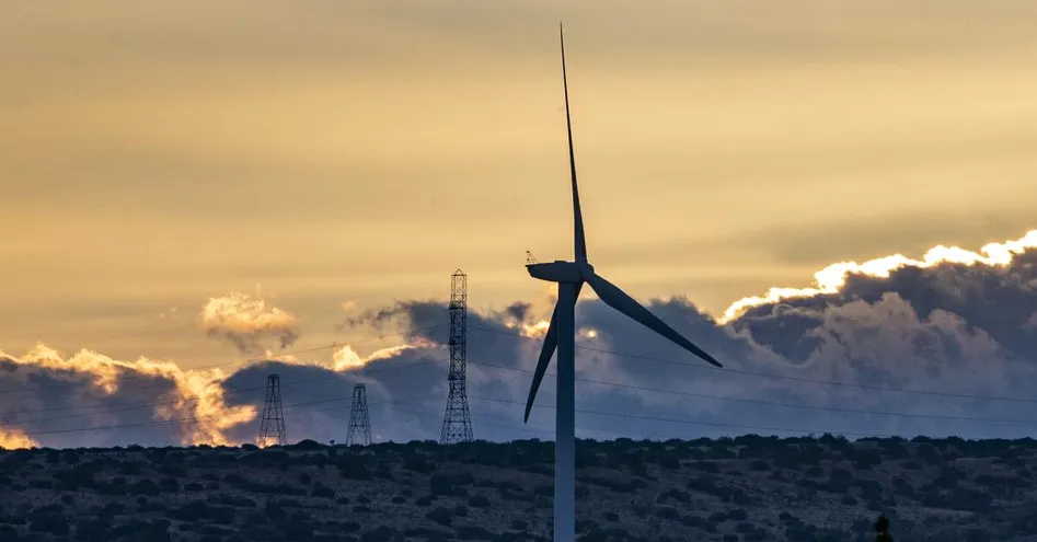 modern wind turbines sunset
